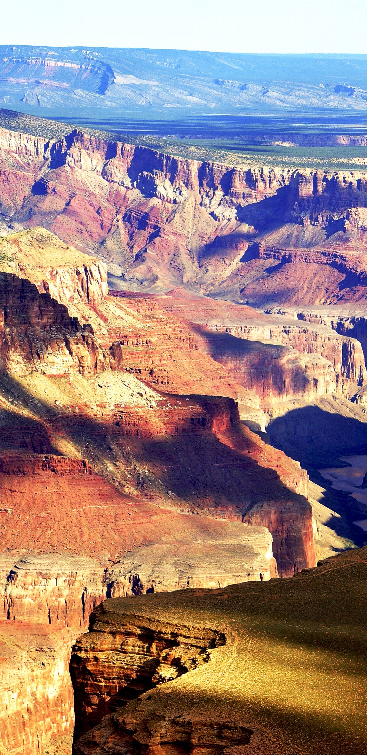 Brown Rocky Mountain Under Blue Sky During Daytime. Wallpaper in 1440x2960 Resolution