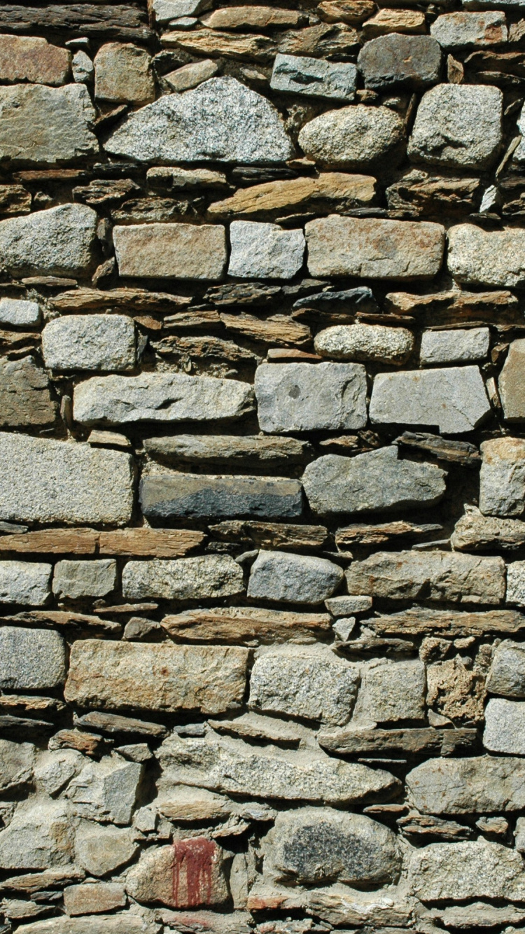 Roter Feuerlöscher Auf Brauner Backsteinmauer. Wallpaper in 750x1334 Resolution