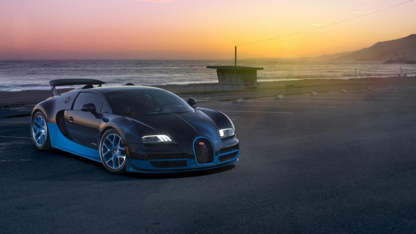 Blaues Bmw m 3 Coupe Tagsüber Unterwegs. Wallpaper in 1366x768 Resolution