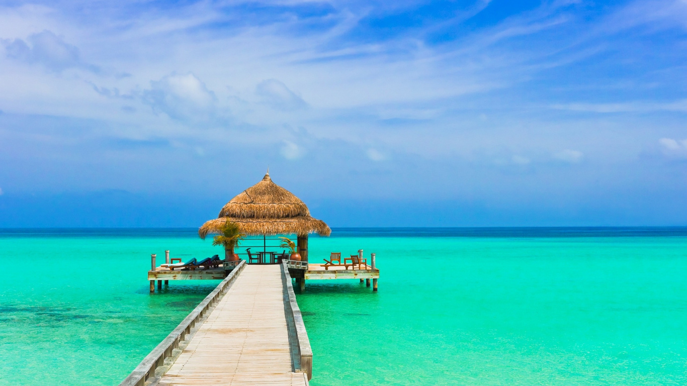 Brown Wooden Dock on Blue Sea Under Blue Sky During Daytime. Wallpaper in 1366x768 Resolution