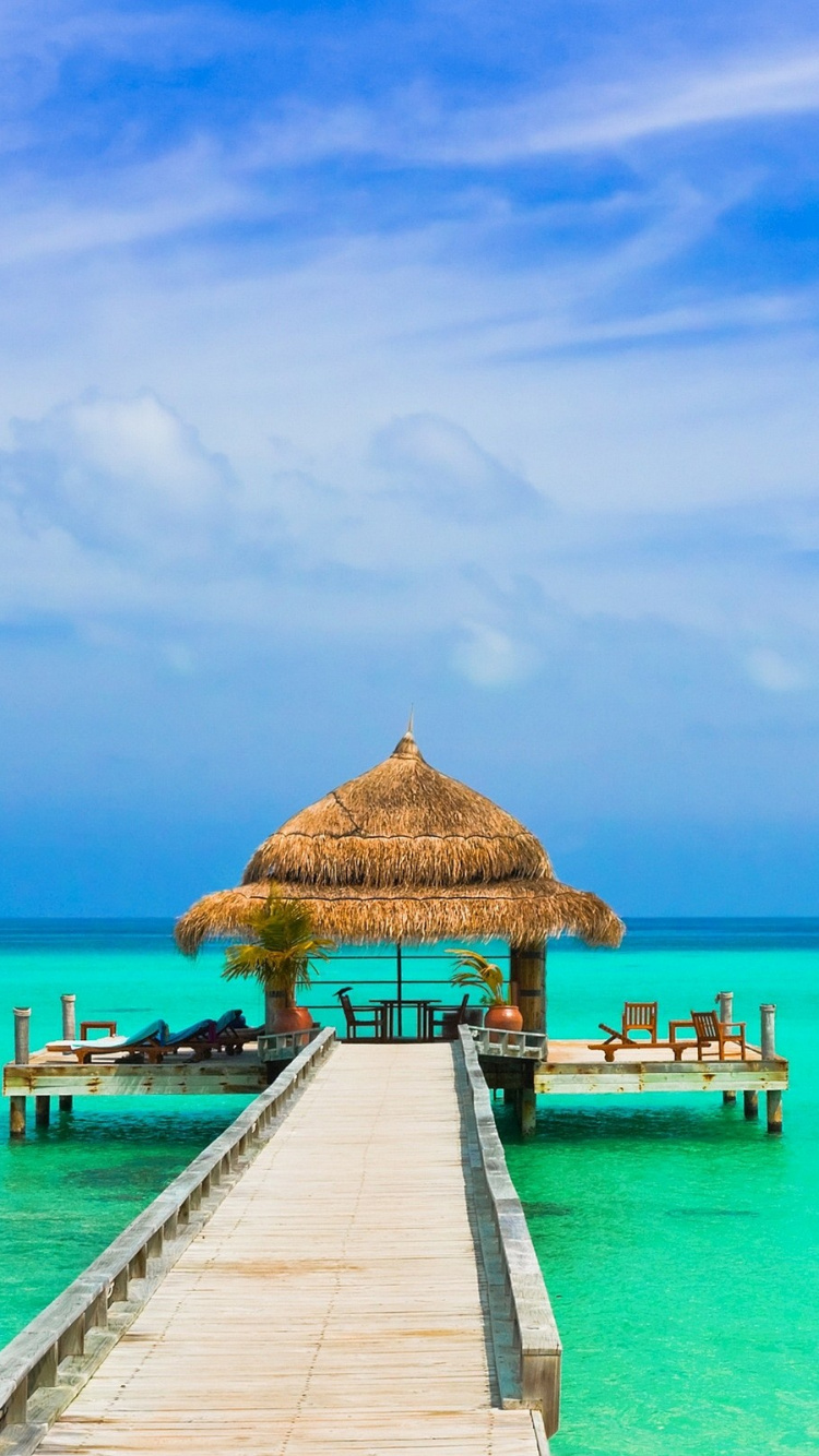 Brown Wooden Dock on Blue Sea Under Blue Sky During Daytime. Wallpaper in 750x1334 Resolution