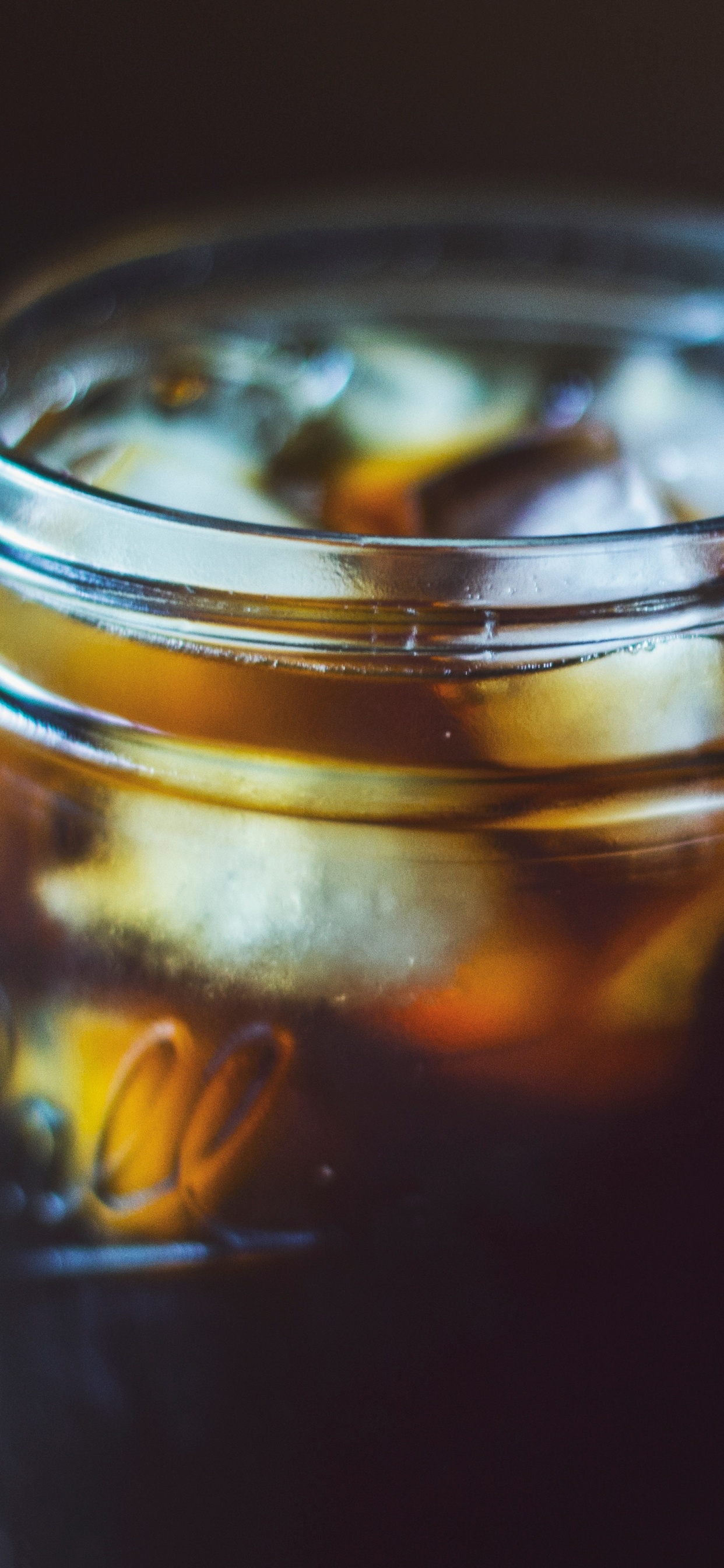 Clear Glass Jar With Yellow Liquid. Wallpaper in 1242x2688 Resolution