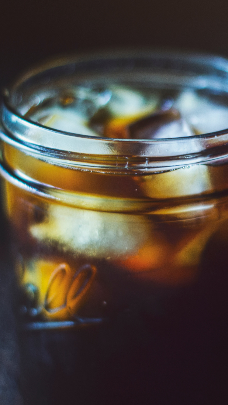 Clear Glass Jar With Yellow Liquid. Wallpaper in 750x1334 Resolution