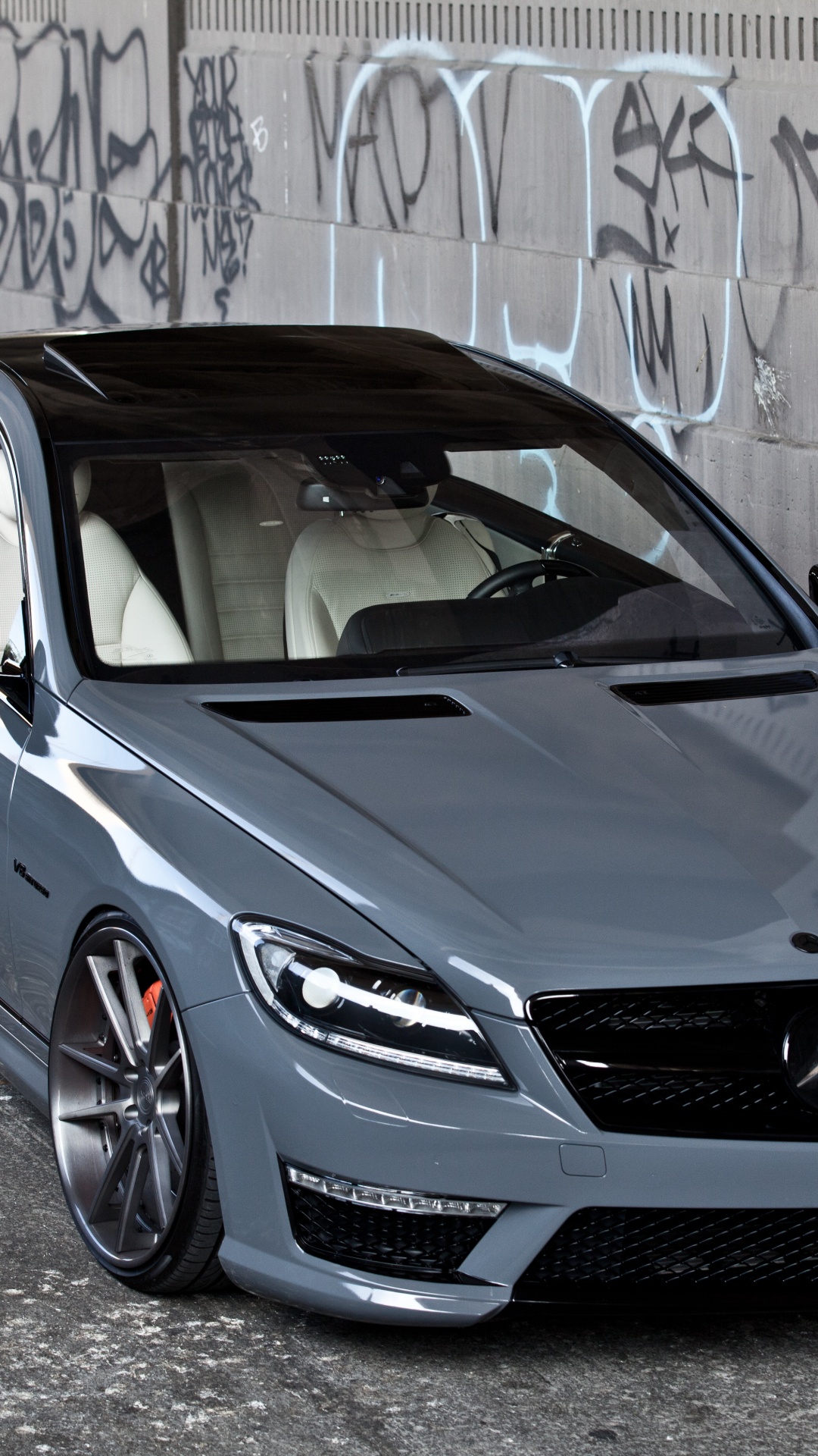 Blue Bmw m 3 Coupe Parked Beside Wall. Wallpaper in 1080x1920 Resolution