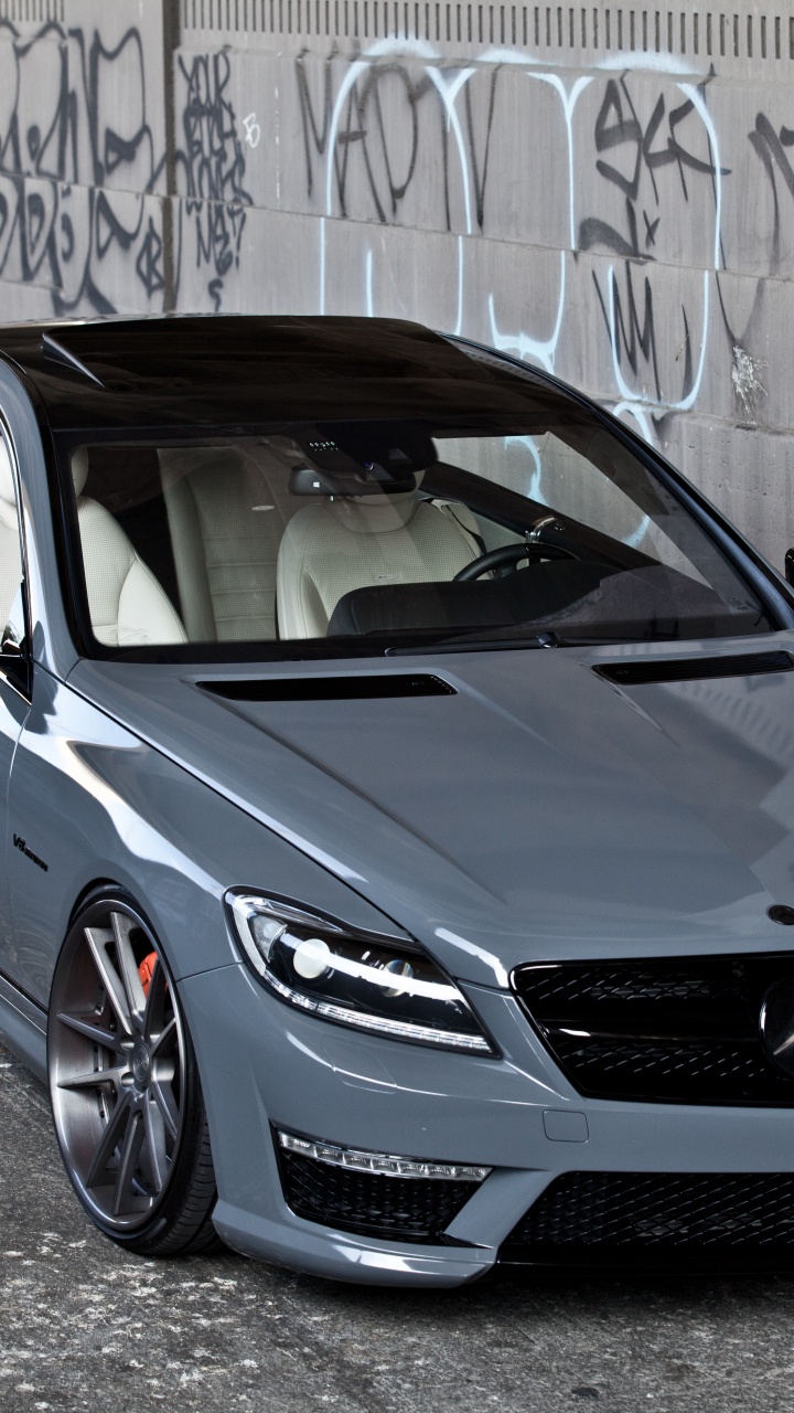 Blue Bmw m 3 Coupe Parked Beside Wall. Wallpaper in 720x1280 Resolution