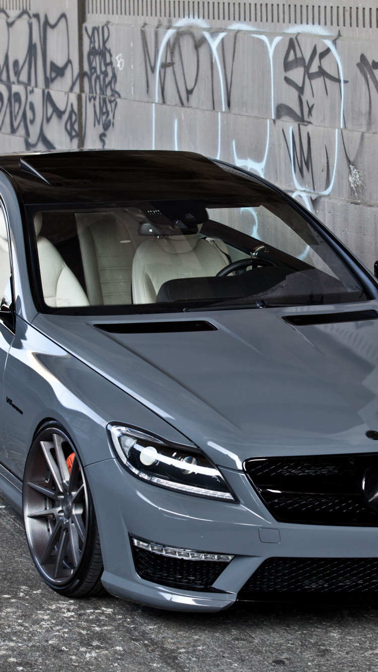 Blue Bmw m 3 Coupe Parked Beside Wall. Wallpaper in 750x1334 Resolution