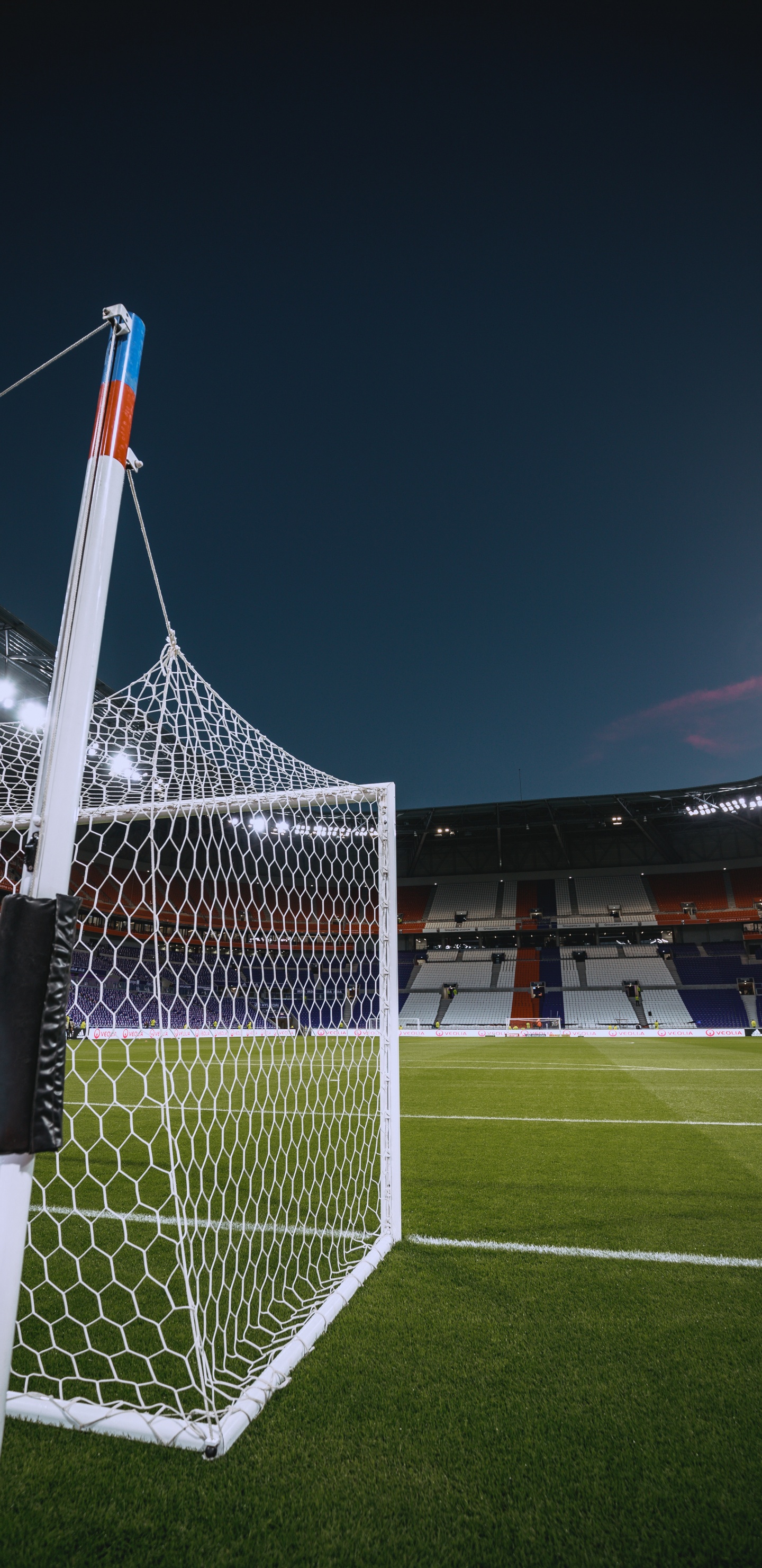 White and Red Flag on Soccer Field During Night Time. Wallpaper in 1440x2960 Resolution