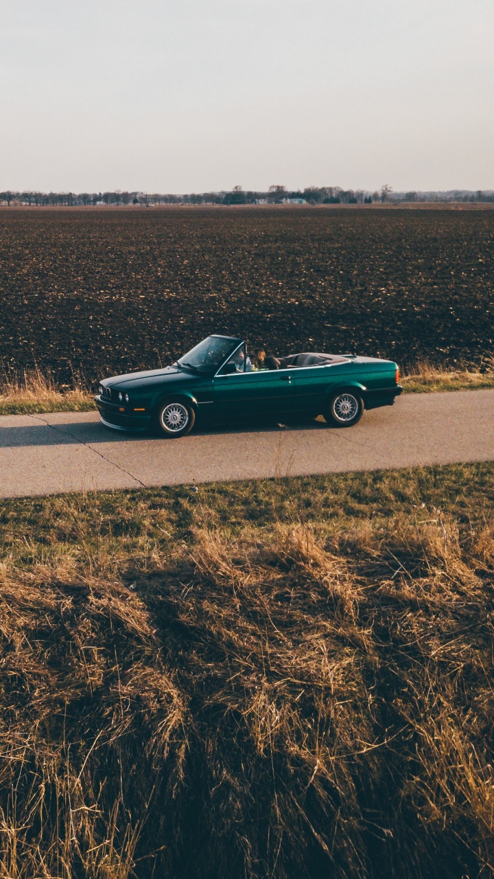Black Coupe on Brown Field During Daytime. Wallpaper in 720x1280 Resolution