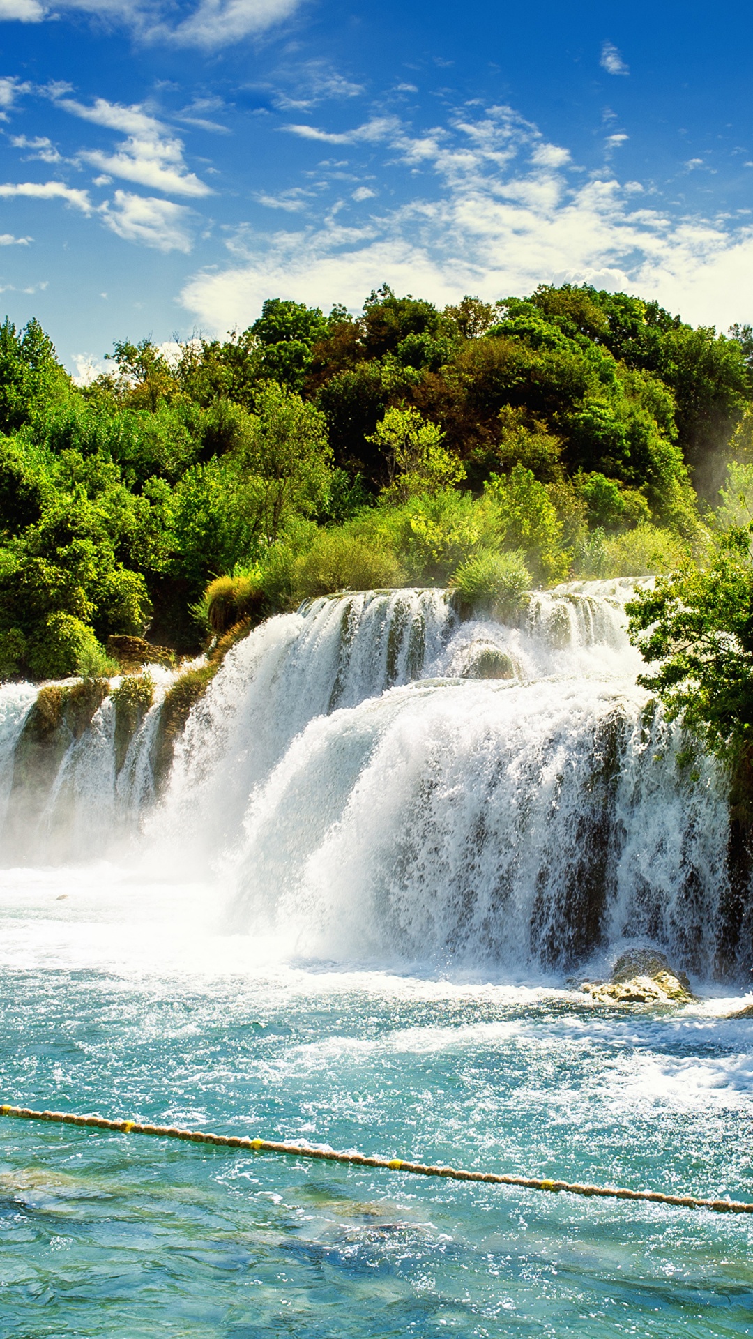 Waterfalls Near Green Trees Under Blue Sky During Daytime. Wallpaper in 1080x1920 Resolution
