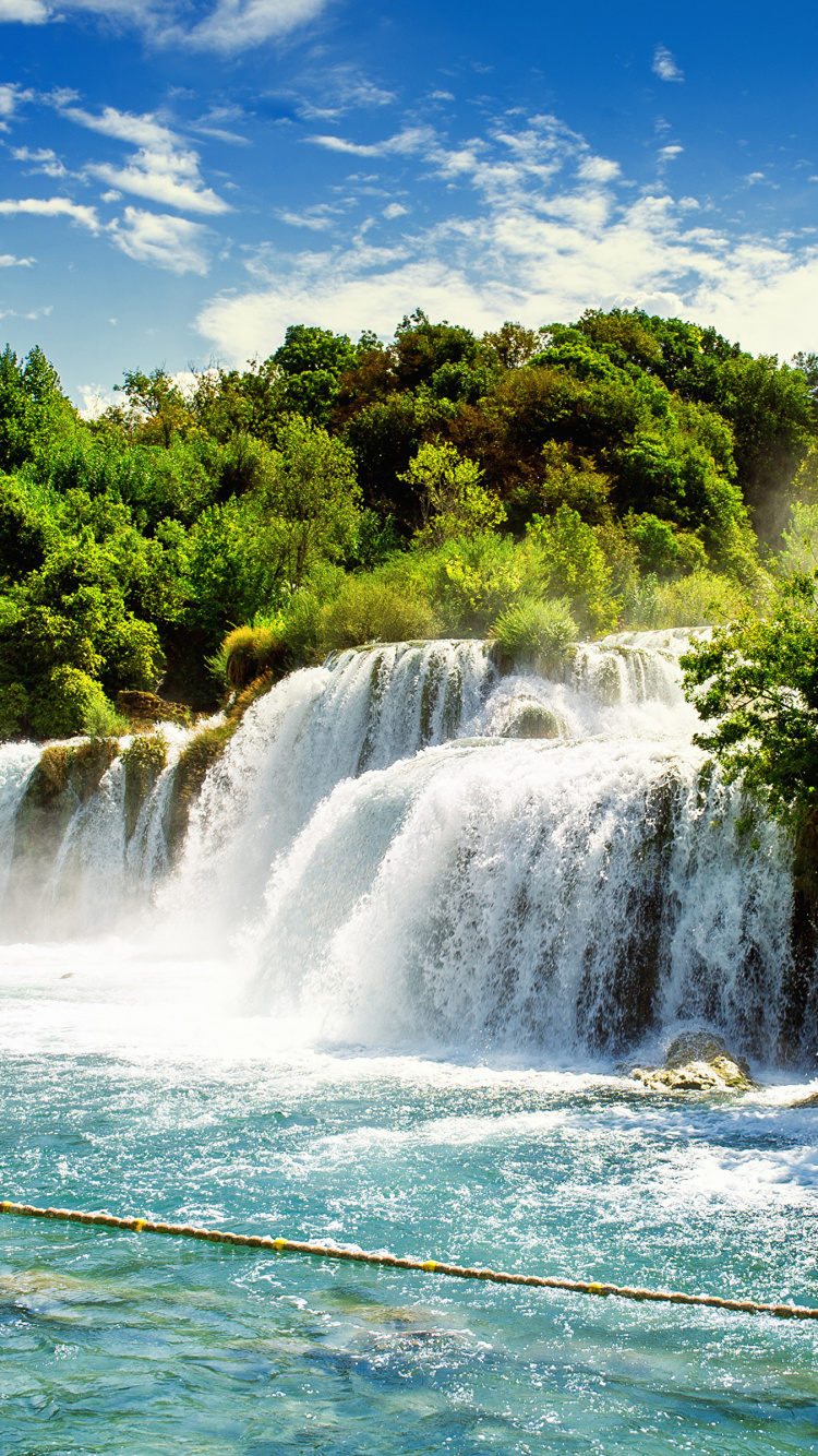 Waterfalls Near Green Trees Under Blue Sky During Daytime. Wallpaper in 750x1334 Resolution