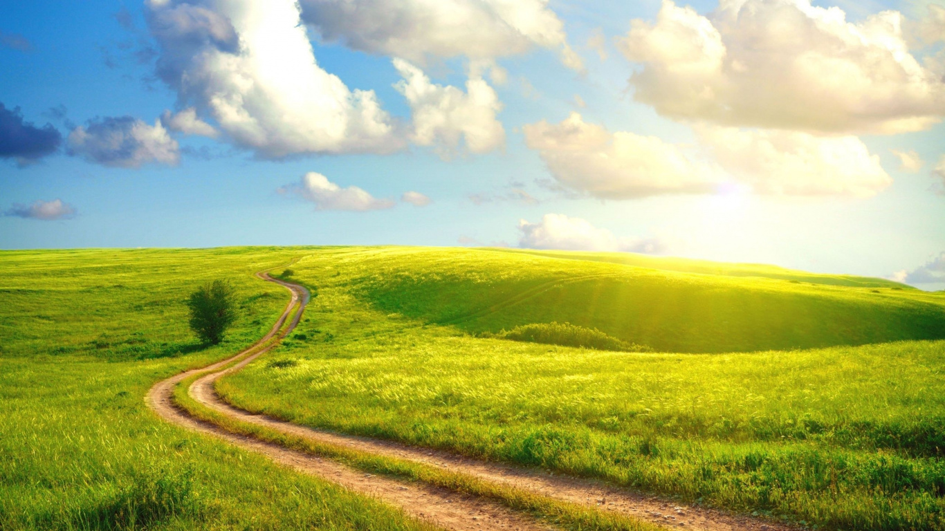 Green Grass Field Under Blue Sky and White Clouds During Daytime. Wallpaper in 1366x768 Resolution