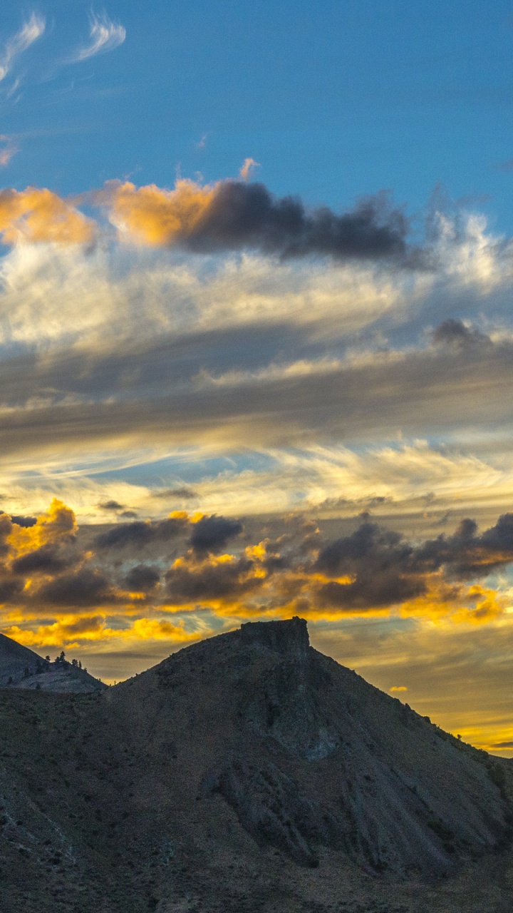 Silhouette of Mountain Under Cloudy Sky During Daytime. Wallpaper in 720x1280 Resolution