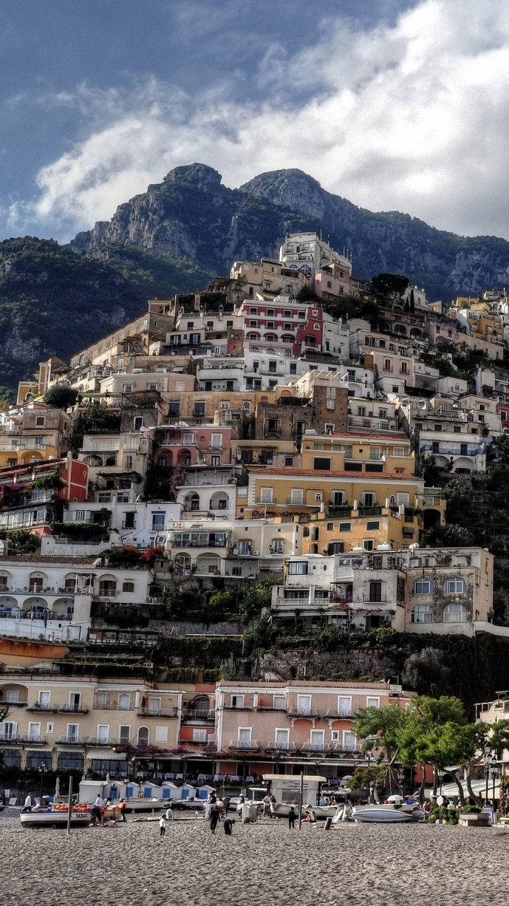 White and Brown Concrete Buildings Near Mountain Under White Clouds During Daytime. Wallpaper in 720x1280 Resolution