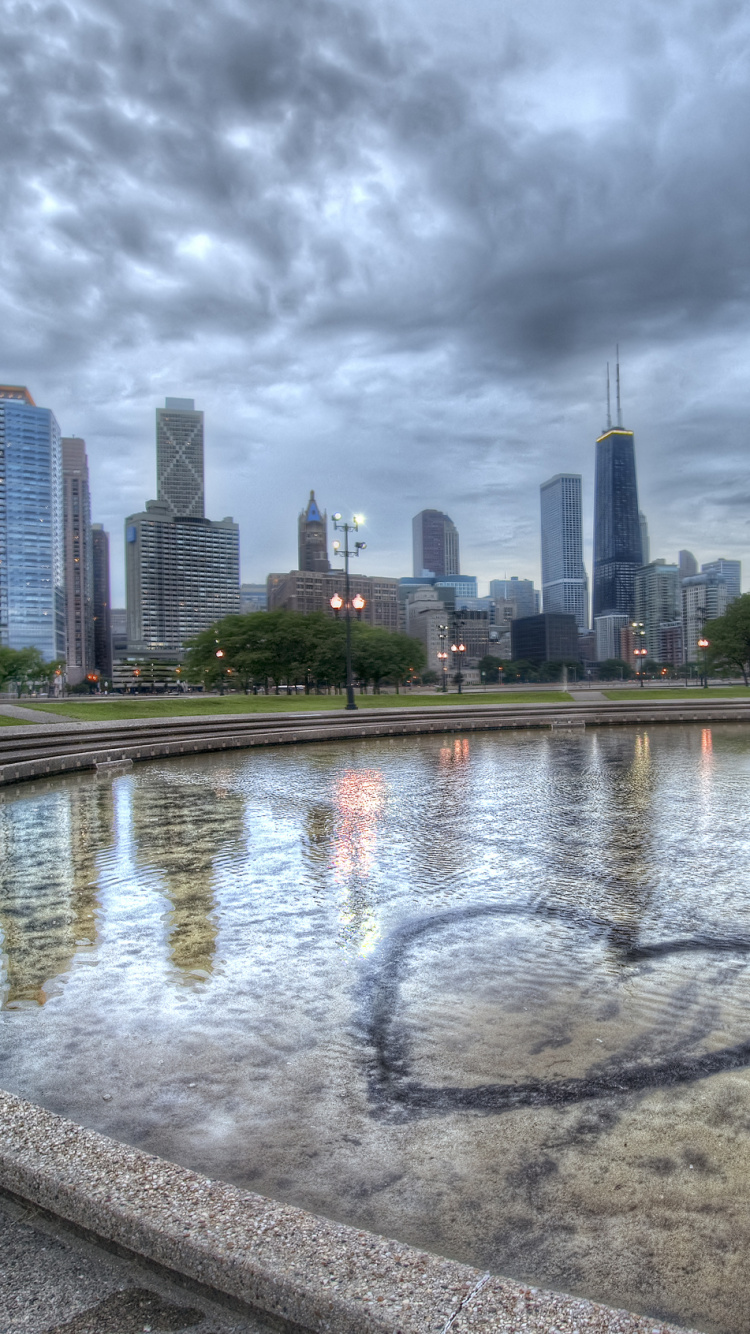 City Skyline Under Gray Cloudy Sky During Daytime. Wallpaper in 750x1334 Resolution