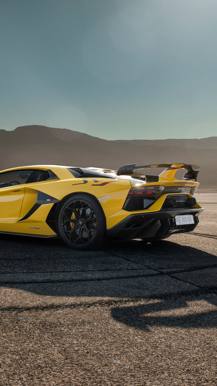 Gelber Porsche 911 Auf Braunem Sand. Wallpaper in 750x1334 Resolution