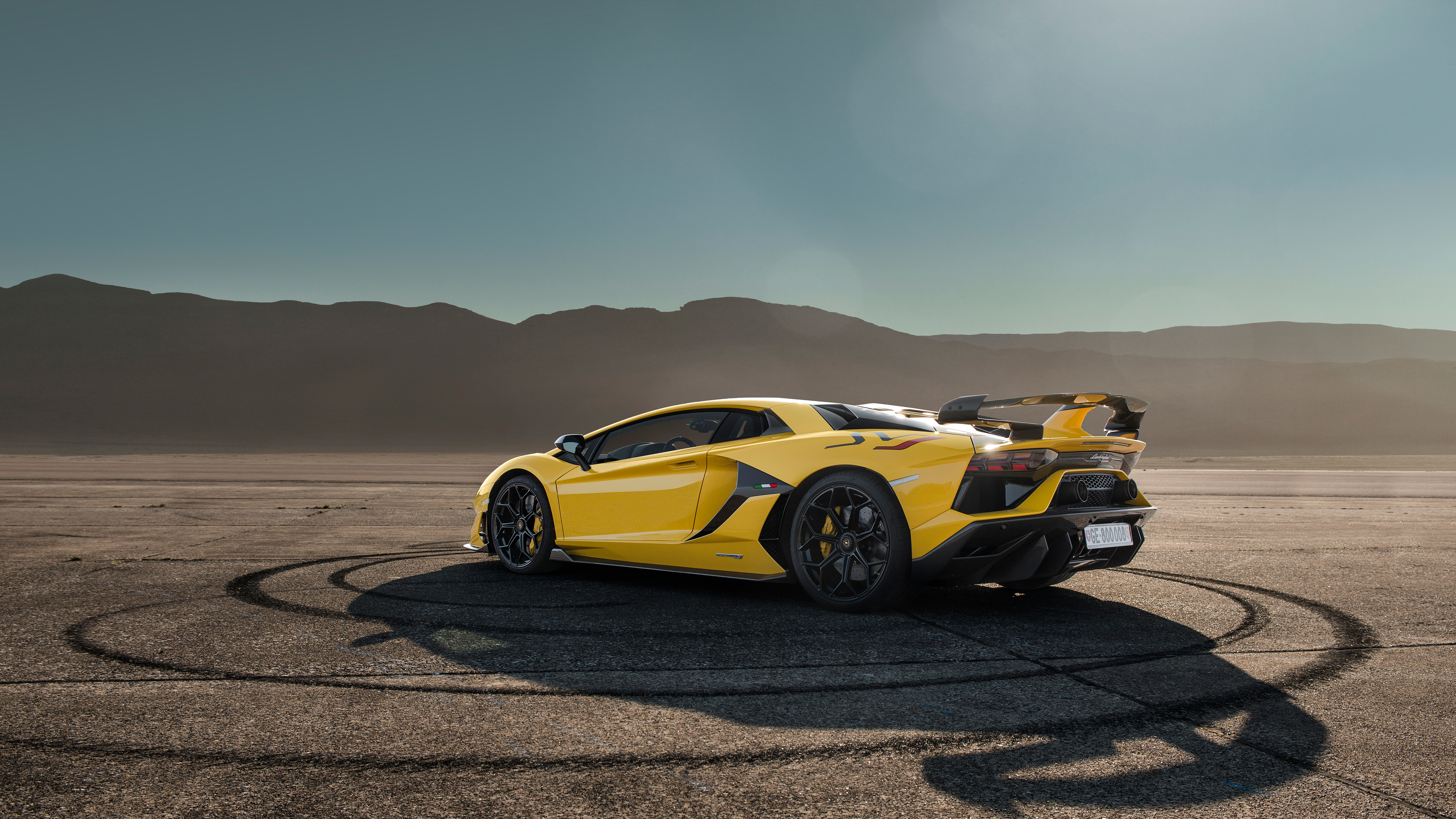 Yellow Porsche 911 on Brown Sand. Wallpaper in 3840x2160 Resolution