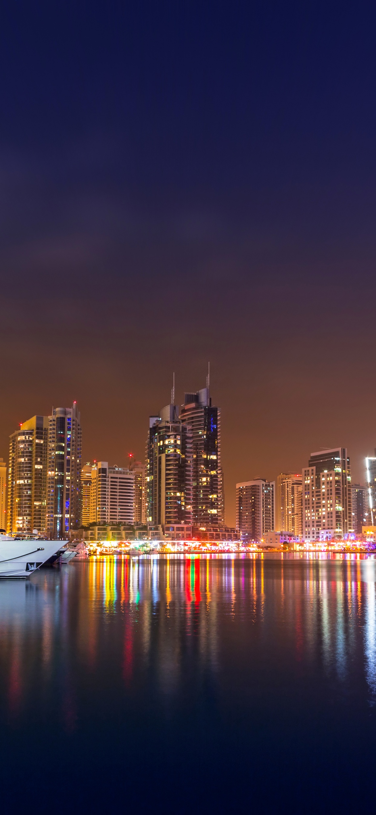 City Skyline During Night Time. Wallpaper in 1242x2688 Resolution