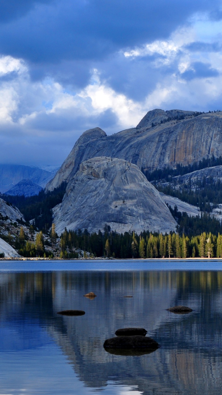 Lake Near Green and Brown Mountains Under White Clouds and Blue Sky During Daytime. Wallpaper in 720x1280 Resolution