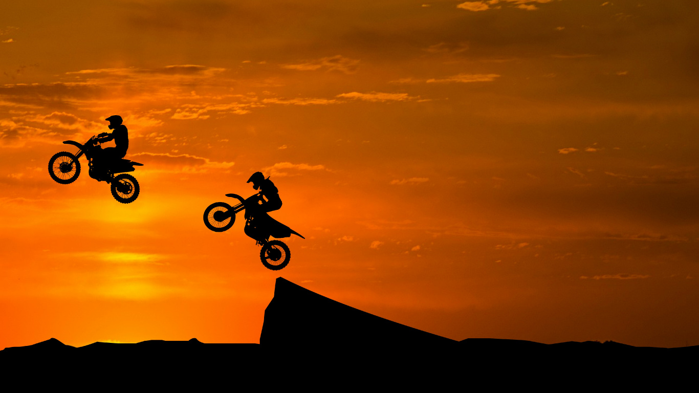 Silhouette of Man Riding Bicycle on Mountain During Sunset. Wallpaper in 1366x768 Resolution