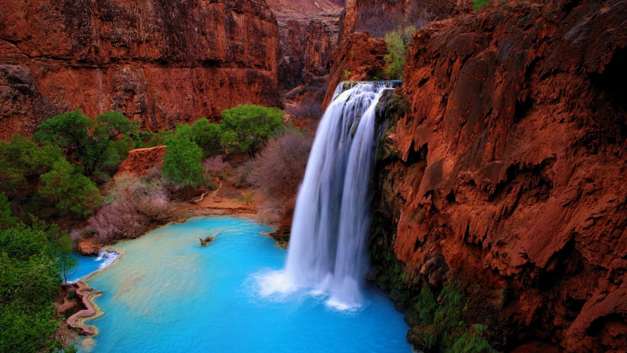 Waterfalls on Brown Rocky Mountain During Daytime. Wallpaper in 1280x720 Resolution