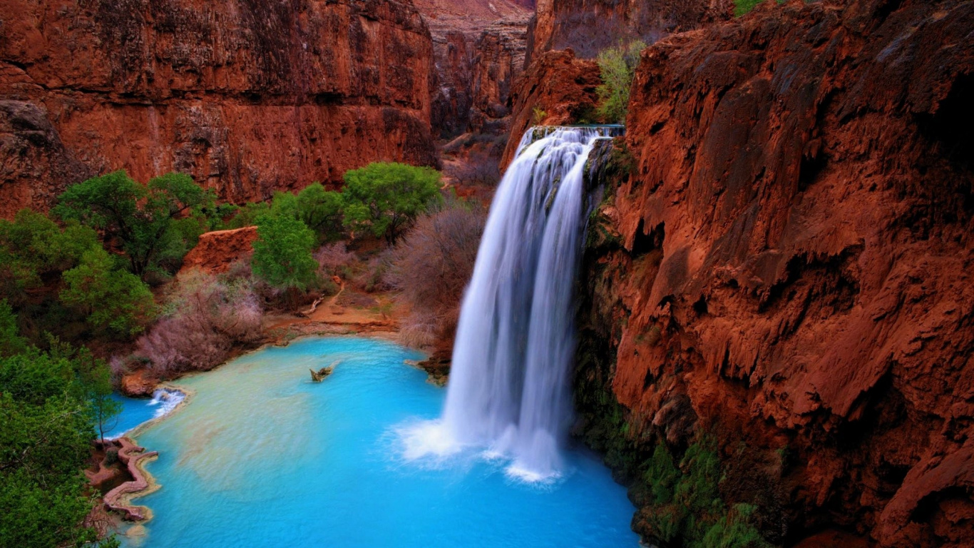 Waterfalls on Brown Rocky Mountain During Daytime. Wallpaper in 1366x768 Resolution