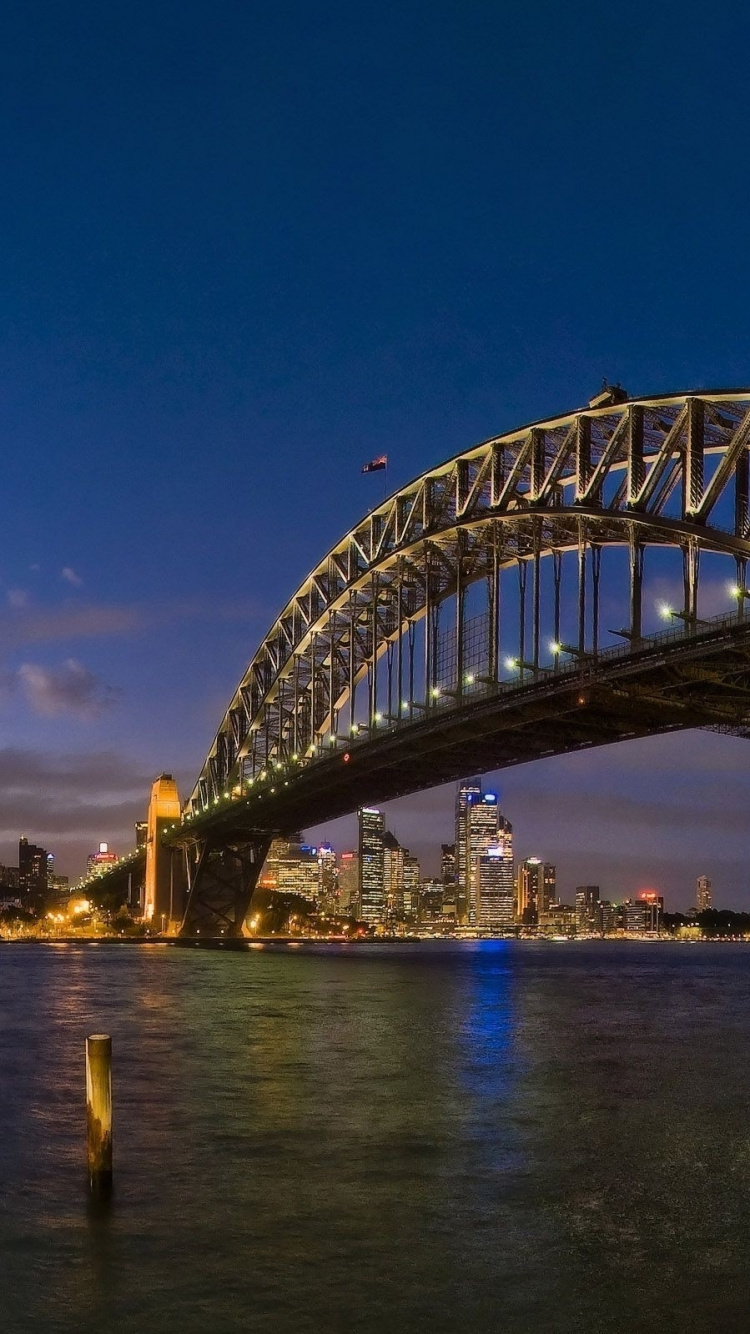 Brown Concrete Building Near Bridge. Wallpaper in 750x1334 Resolution