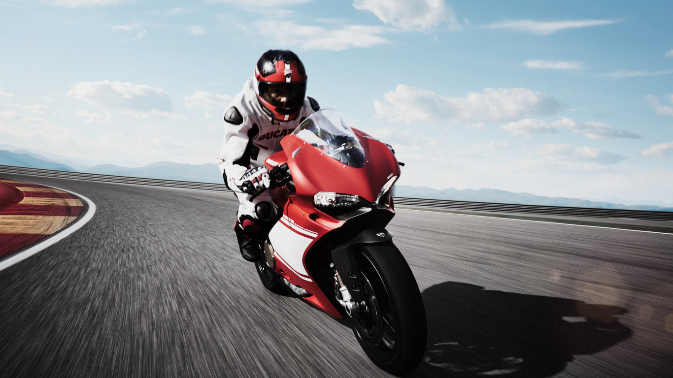 Man in Orange and Black Motorcycle Suit Riding on Red and White Sports Bike. Wallpaper in 1366x768 Resolution