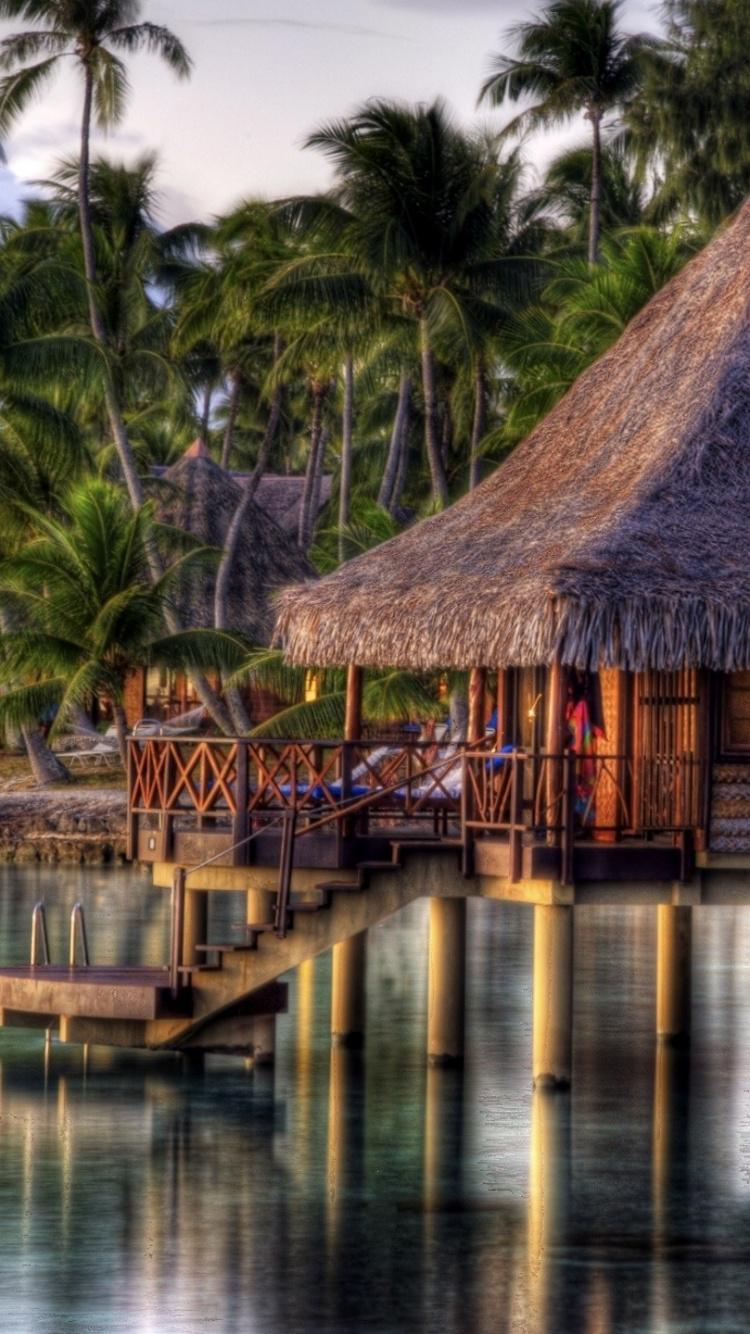 Brown Wooden House on Body of Water During Daytime. Wallpaper in 750x1334 Resolution