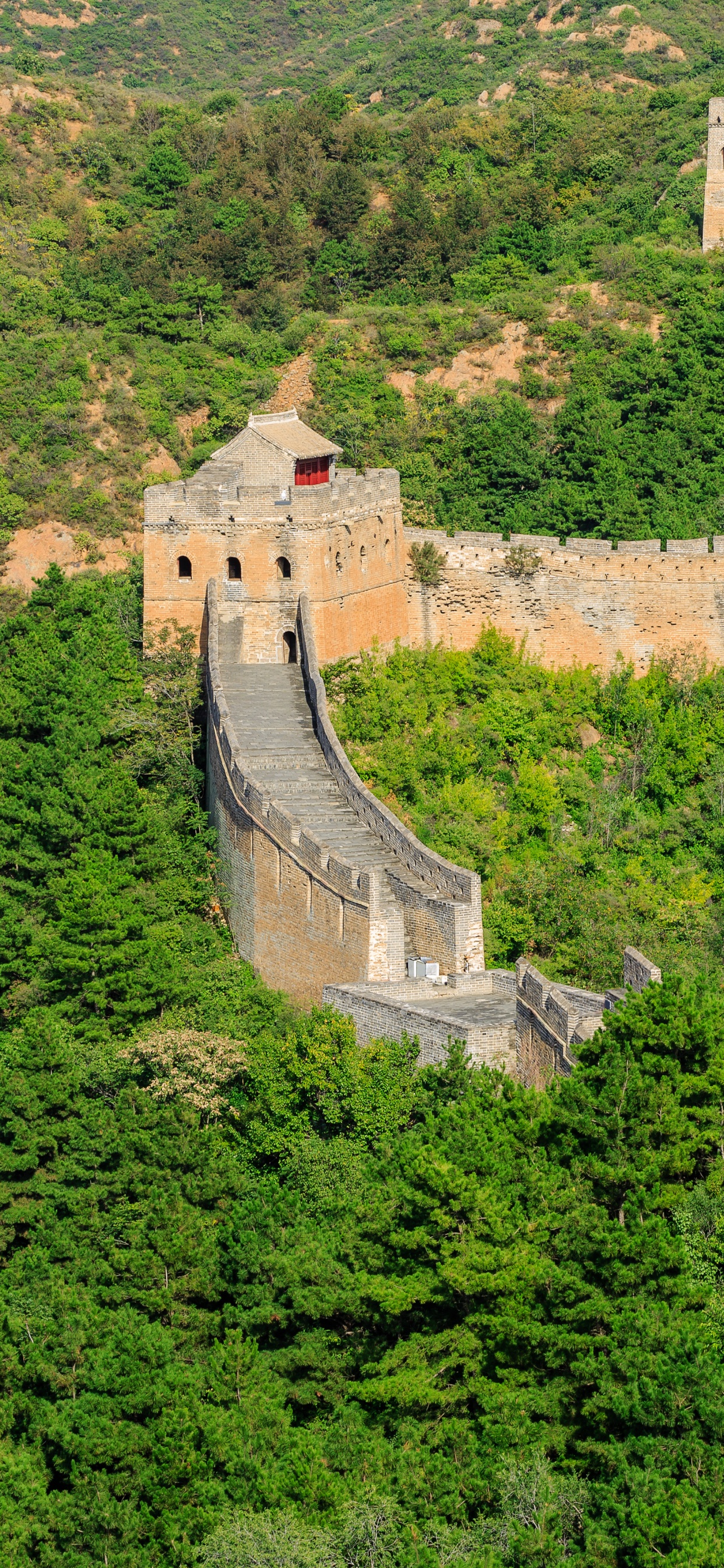 Aerial View of Gray Concrete Building on Top of Hill. Wallpaper in 1242x2688 Resolution