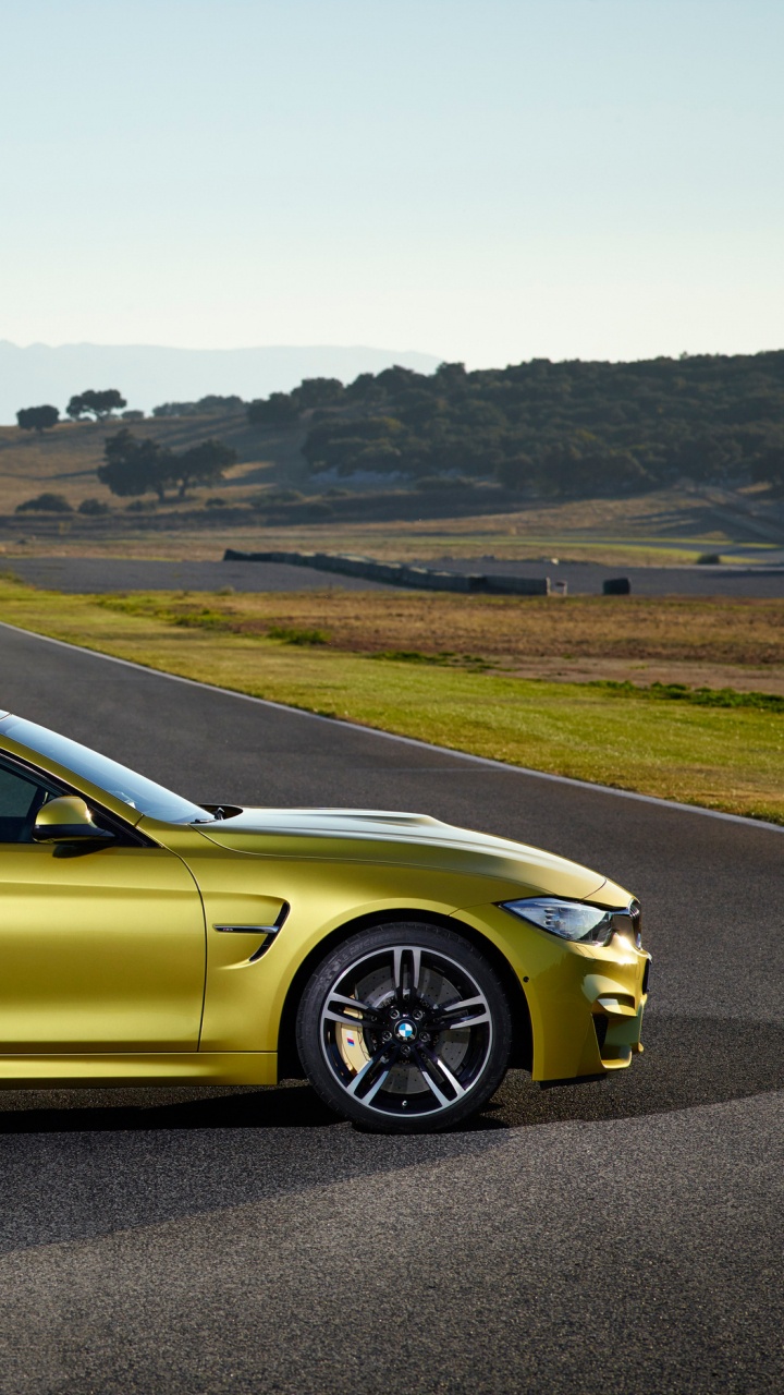 Yellow Coupe on Road During Daytime. Wallpaper in 720x1280 Resolution