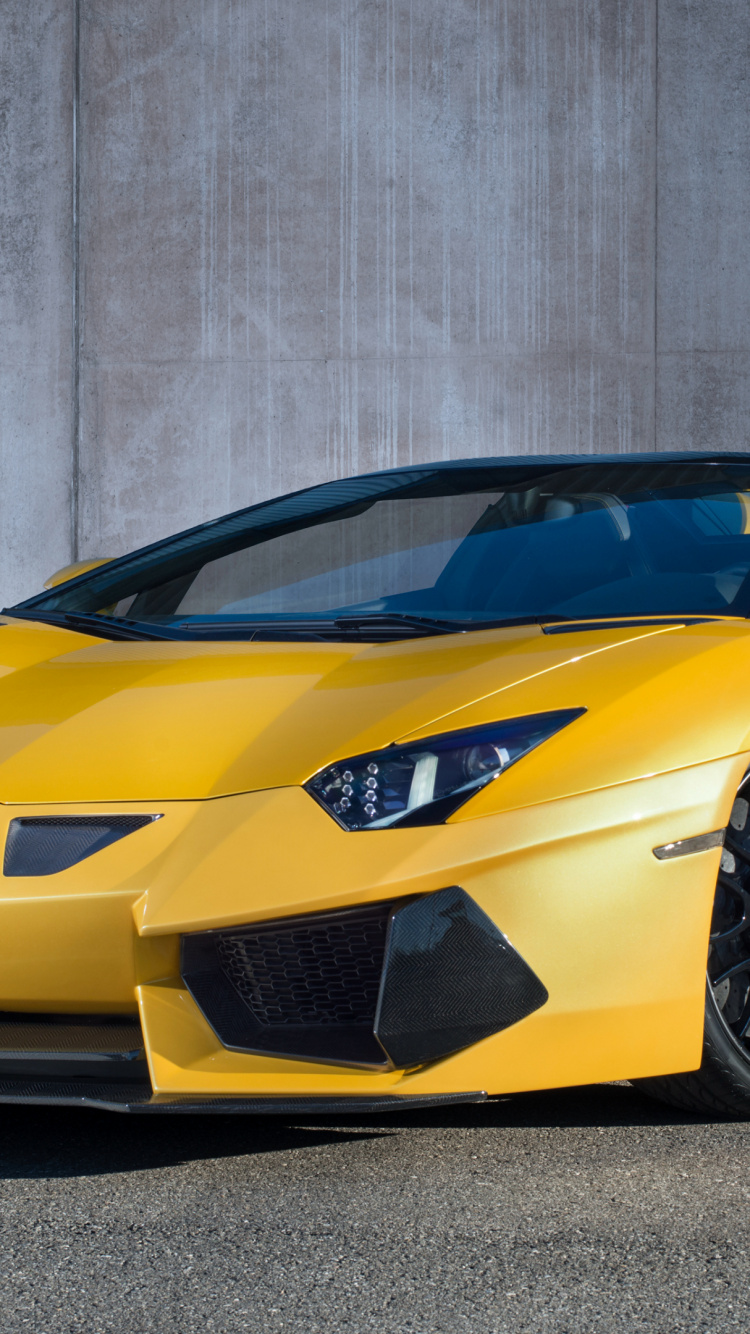 Yellow Lamborghini Aventador Parked Near Gray Wall. Wallpaper in 750x1334 Resolution