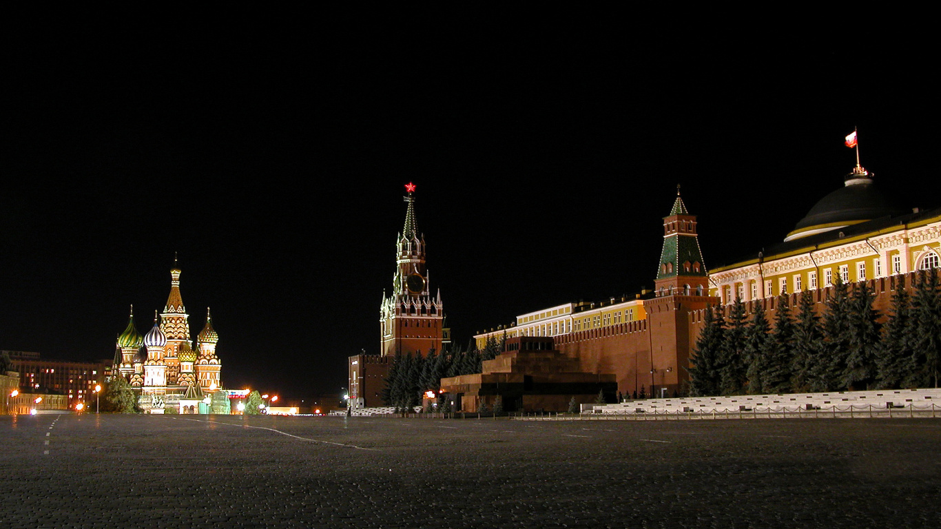 Brown Concrete Building During Nighttime. Wallpaper in 1366x768 Resolution