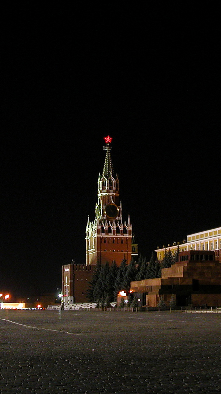 Edificio de Hormigón Marrón Durante la Noche.. Wallpaper in 750x1334 Resolution