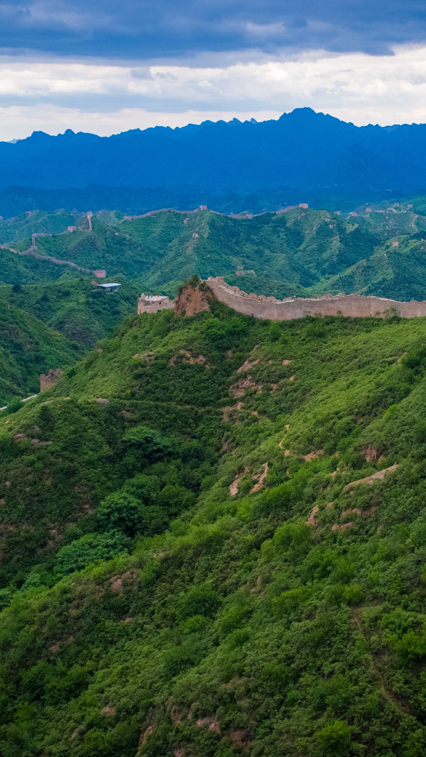 Green Grass Covered Mountain Under Blue Sky During Daytime. Wallpaper in 1440x2560 Resolution