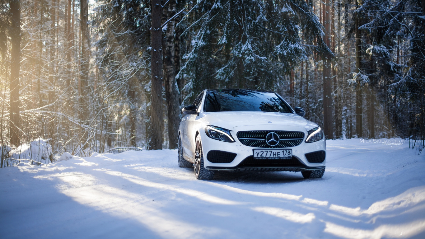 White Mercedes Benz Car on Snow Covered Road During Daytime. Wallpaper in 1366x768 Resolution