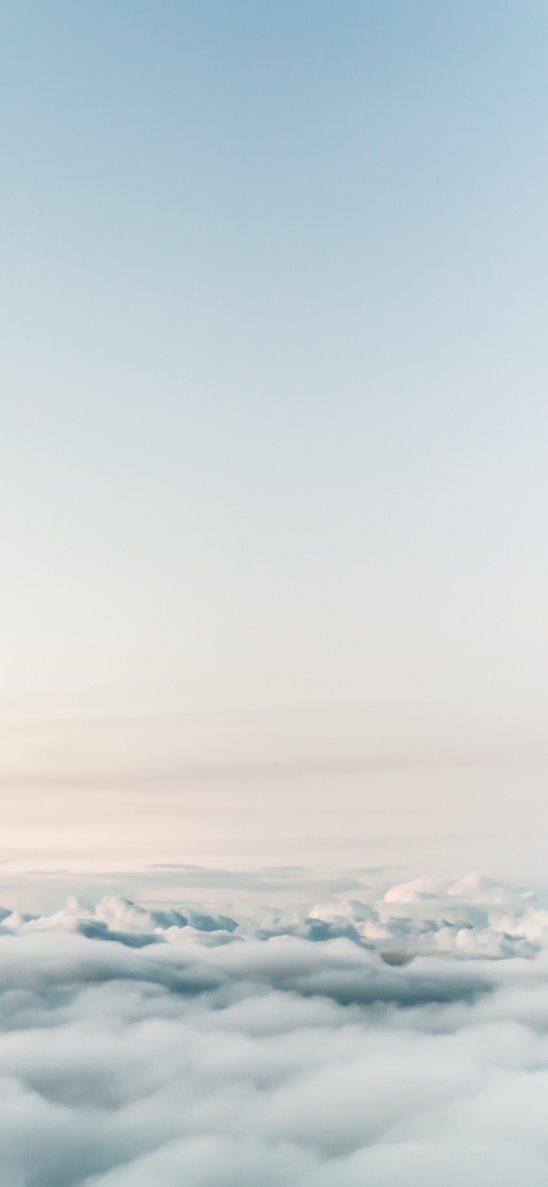 White Clouds Over The Mountains. Wallpaper in 1125x2436 Resolution