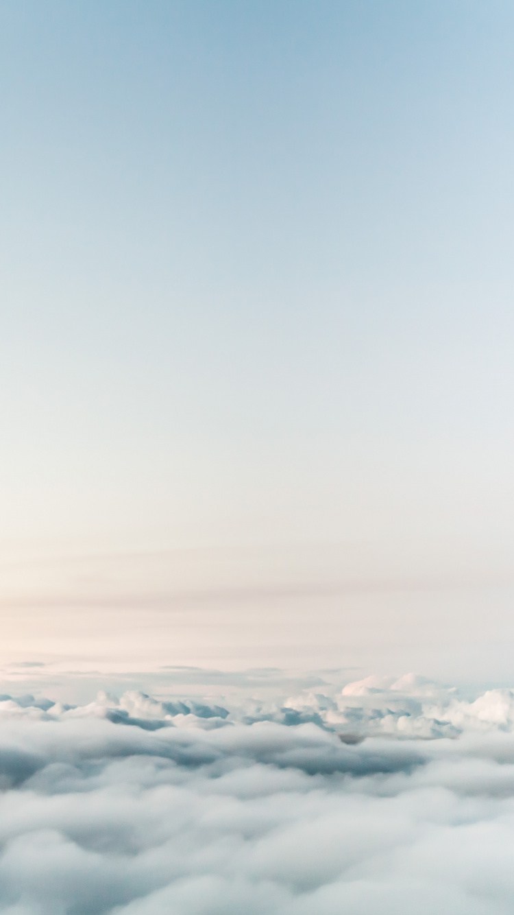 White Clouds Over The Mountains. Wallpaper in 750x1334 Resolution