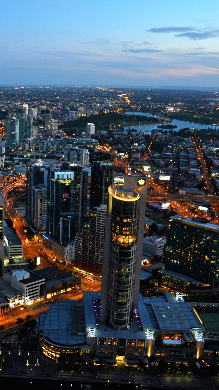 Aerial View of City Buildings During Night Time. Wallpaper in 750x1334 Resolution