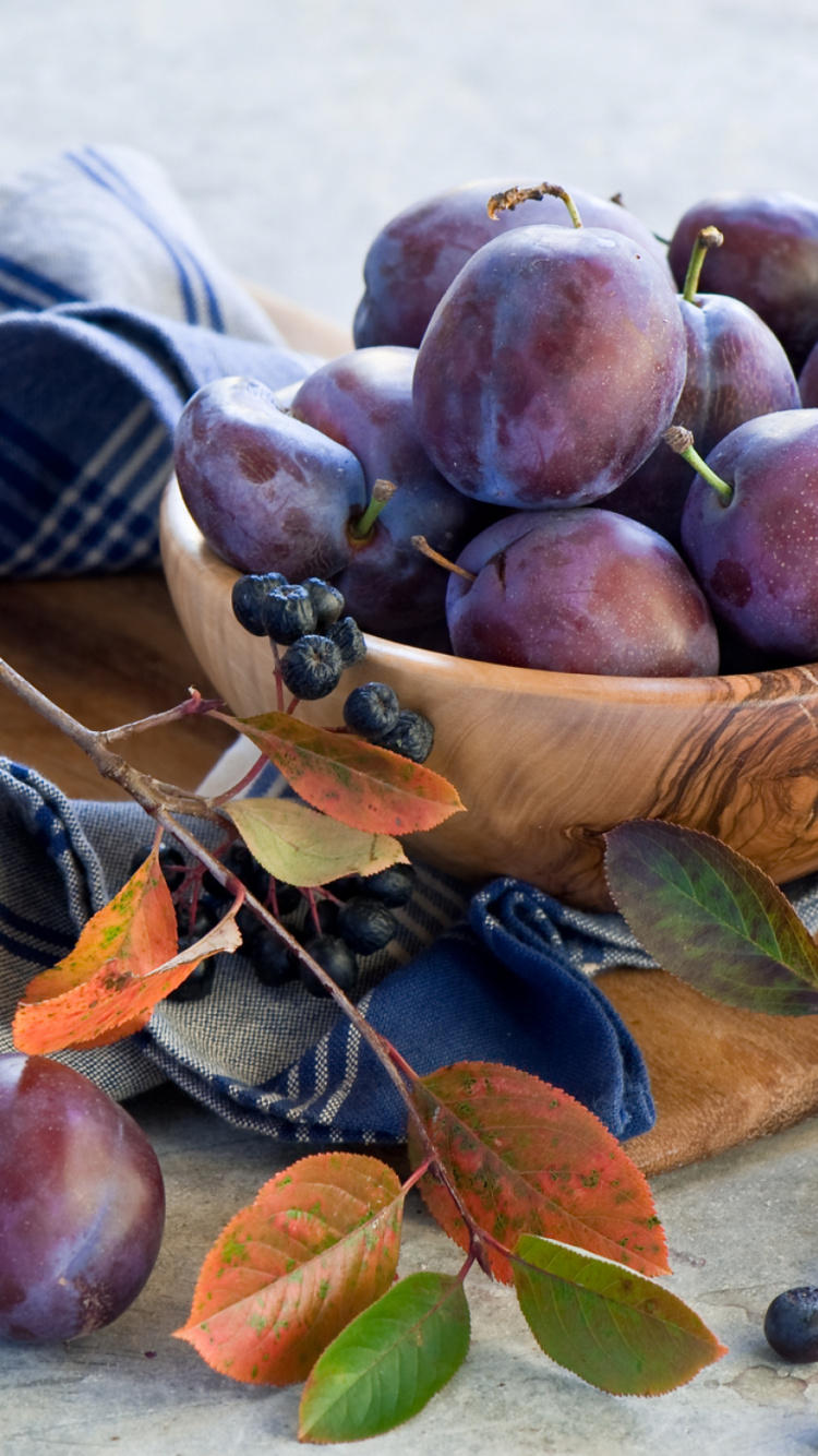 Brown and Beige Woven Baskets With Red Round Fruits. Wallpaper in 750x1334 Resolution