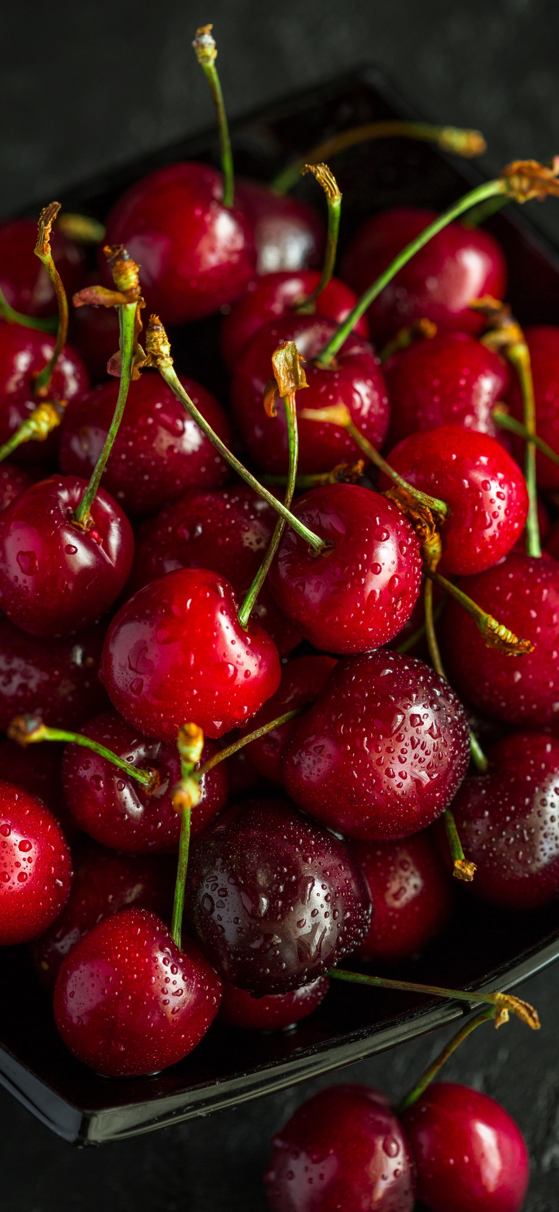 Red Cherries on Stainless Steel Bowl. Wallpaper in 1125x2436 Resolution