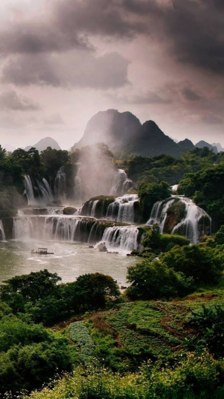 Green Trees Near Water Falls. Wallpaper in 750x1334 Resolution