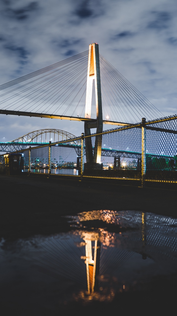 Bridge Over Water During Night Time. Wallpaper in 720x1280 Resolution