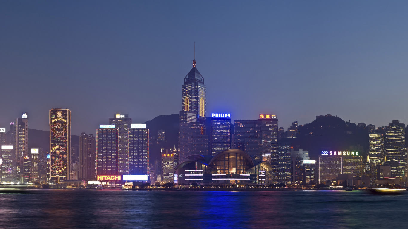 City Skyline Near Body of Water During Night Time. Wallpaper in 1366x768 Resolution