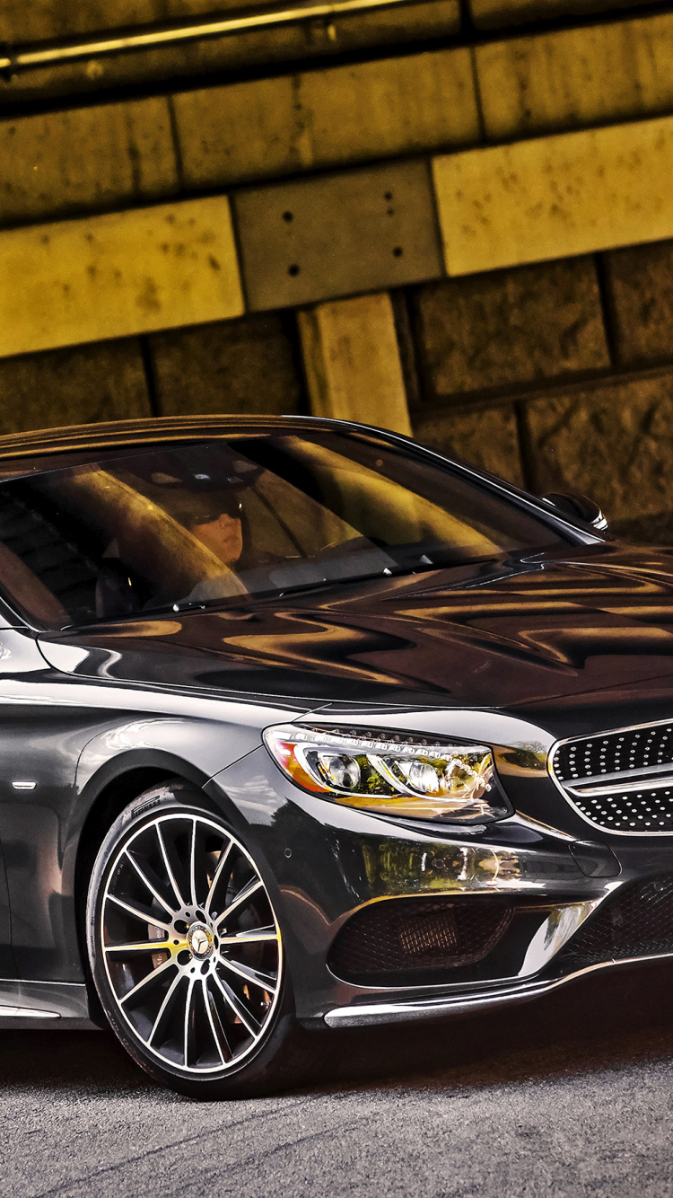 Black Mercedes Benz Coupe Parked on Gray Concrete Pavement. Wallpaper in 750x1334 Resolution