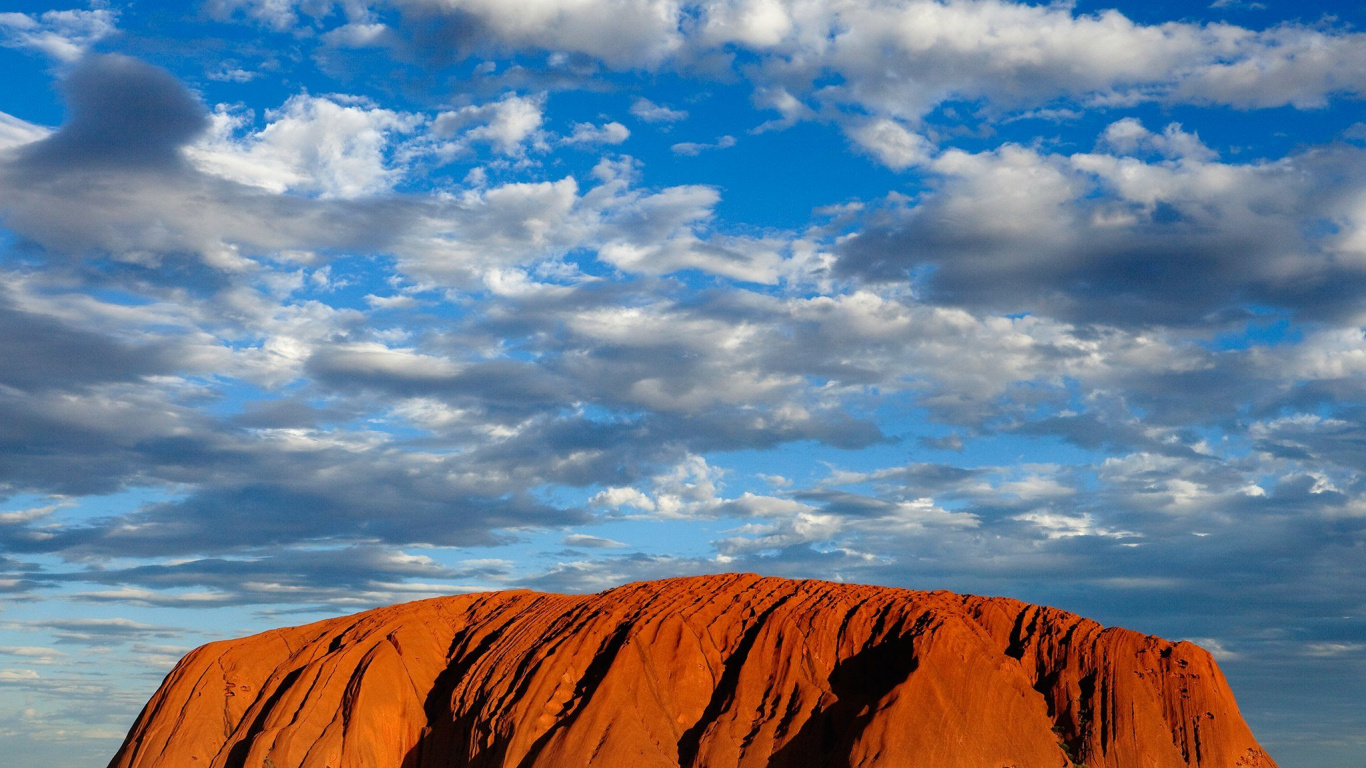Brown Mountain Under Blue Sky During Daytime. Wallpaper in 1366x768 Resolution