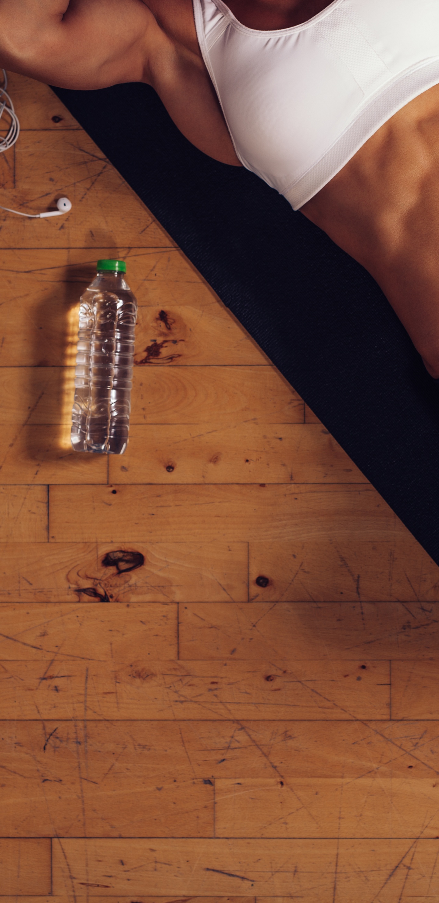 Person in White Tank Top and Black Shorts. Wallpaper in 1440x2960 Resolution