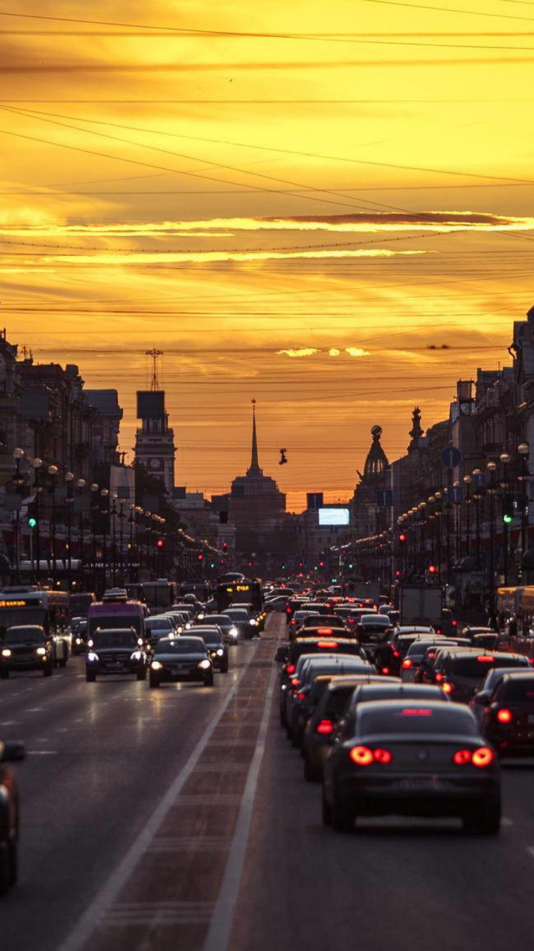 Cars on Road During Sunset. Wallpaper in 750x1334 Resolution