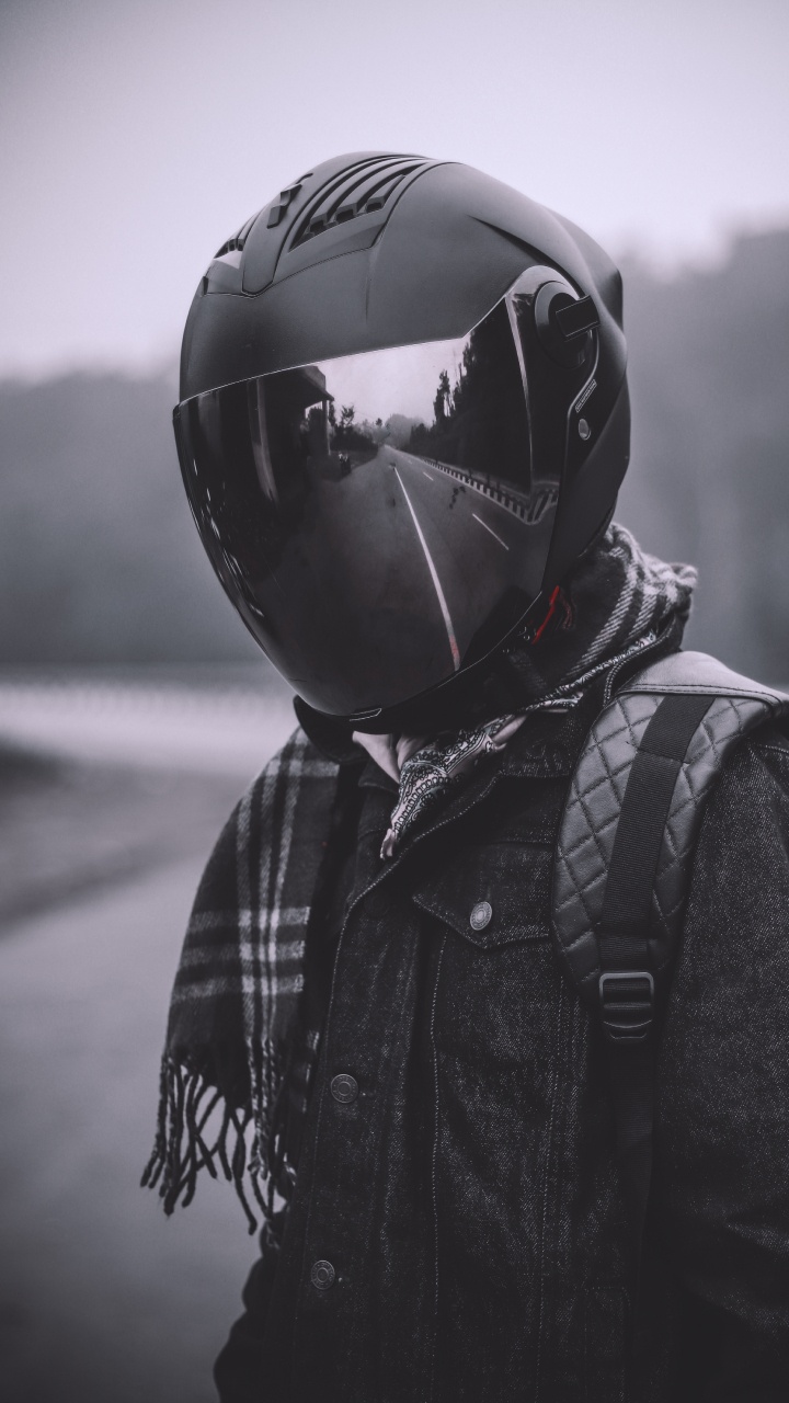 Person in Black and White Jacket Wearing Black Helmet. Wallpaper in 720x1280 Resolution