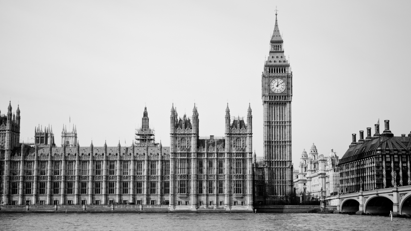 Grayscale Photo of Concrete Building Near Body of Water. Wallpaper in 1366x768 Resolution