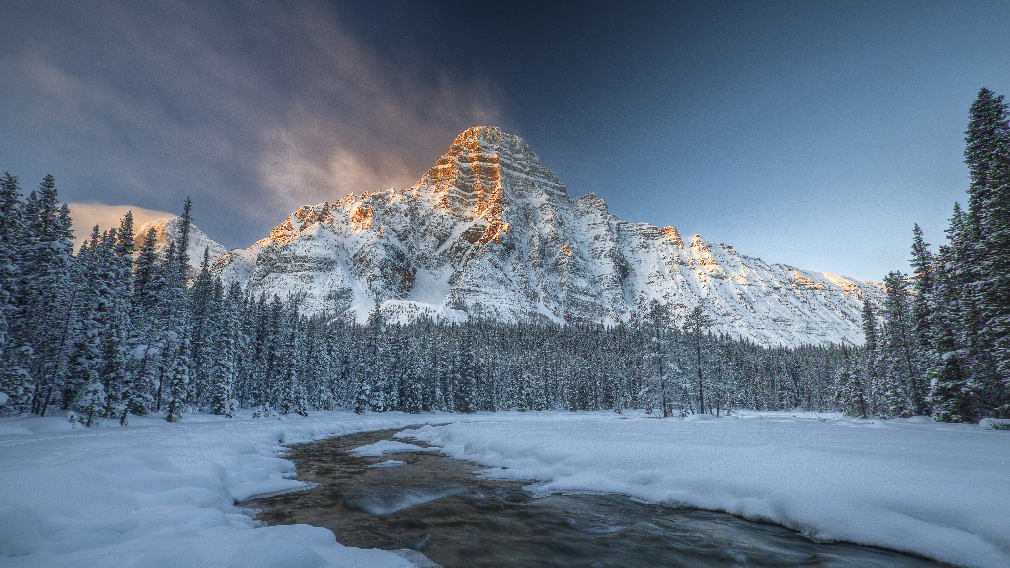 Snow Covered Mountain Under Blue Sky. Wallpaper in 3840x2160 Resolution